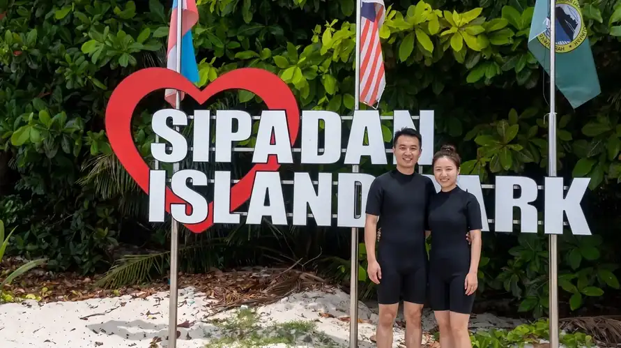 Scuba diving at Sipadan Island with Amina Holidays near the Tun Sakaran Marine Park to see coral reefs and sea life.