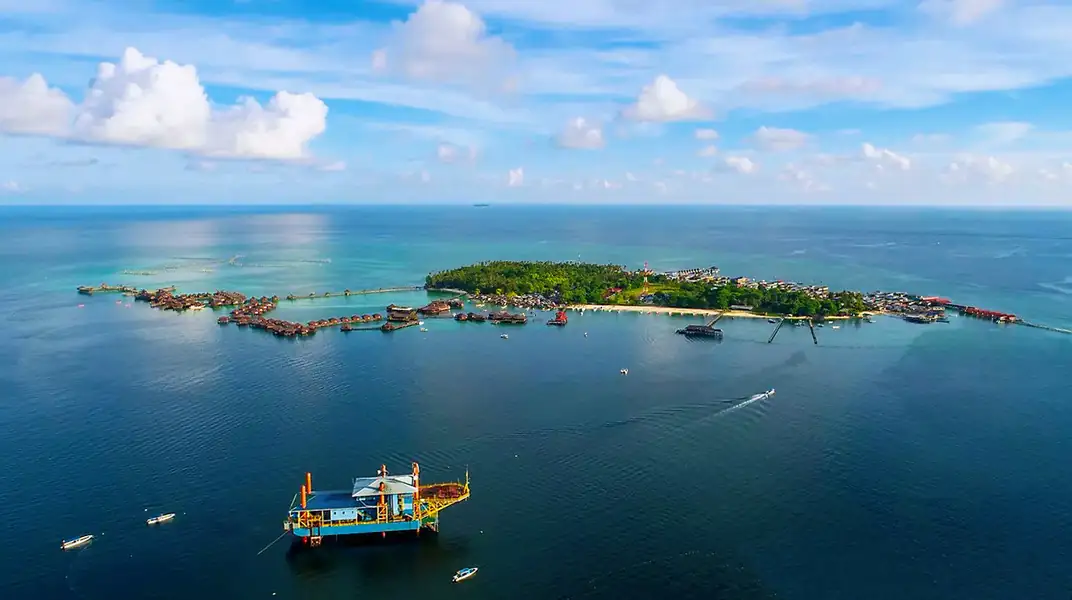 Aerial drone view of island hopping boats in the lagoon Amina Holidays