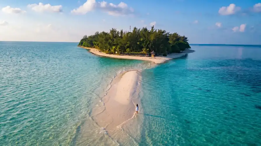 The white sands and crystal clear waters of Sibuan Island with Amina Holidays in the Semporna Archipelago.