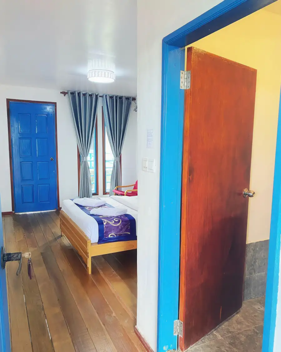 Deluxe double bedroom at Amina Holidays overwater resort on Mabul Island
