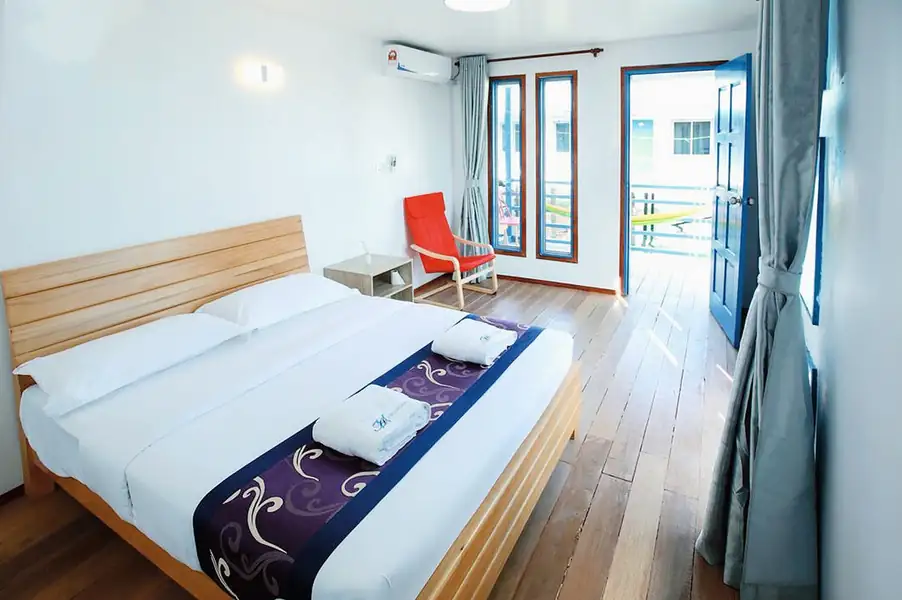 Teak floor detail in the Deluxe Double Room with Sea View at Amina Holidays
