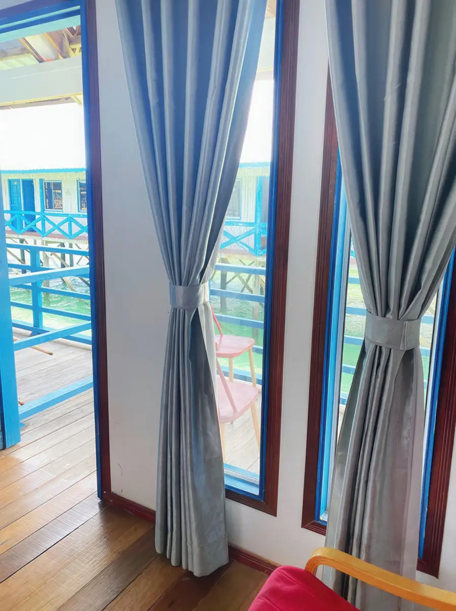 Sunlit Deluxe Double Room with natural light and sea view at Amina Holidays