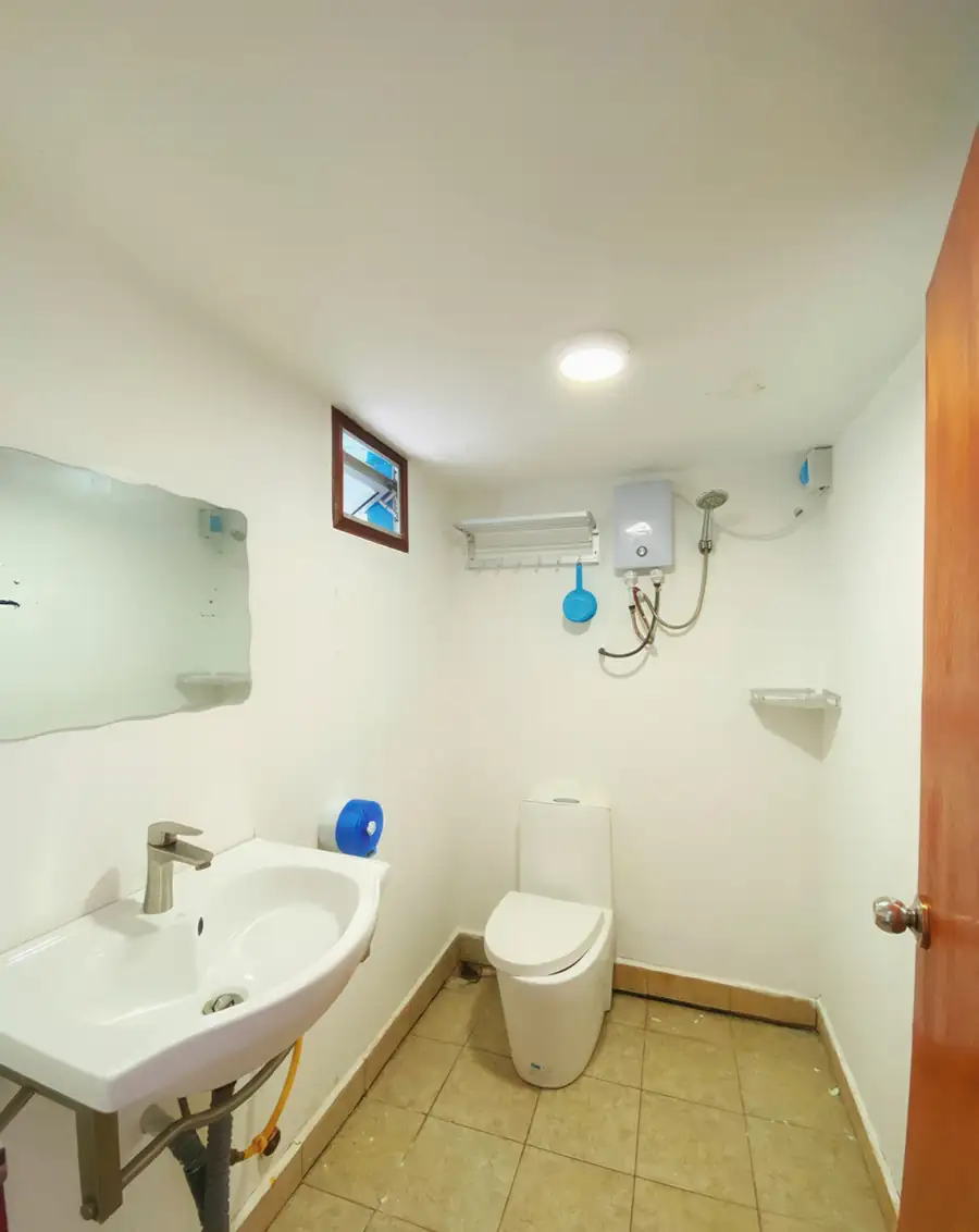 Clean en-suite bathroom in the Family Room at Amina Holidays on Mabul Island