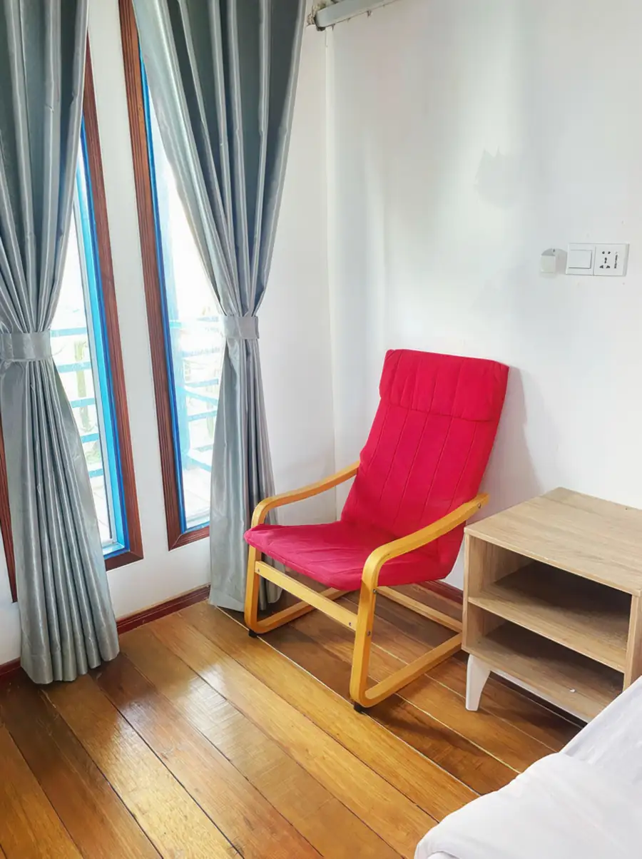 Cosy bedroom corner seating area in the Family Room at Amina Holidays