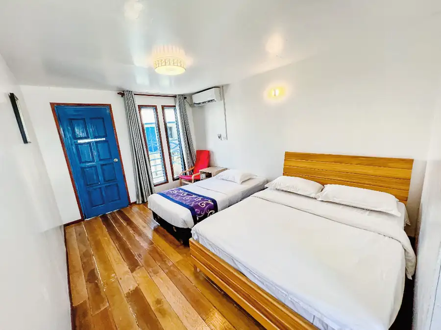 Teak floor interior of the Family Room at Amina Holidays overwater resort