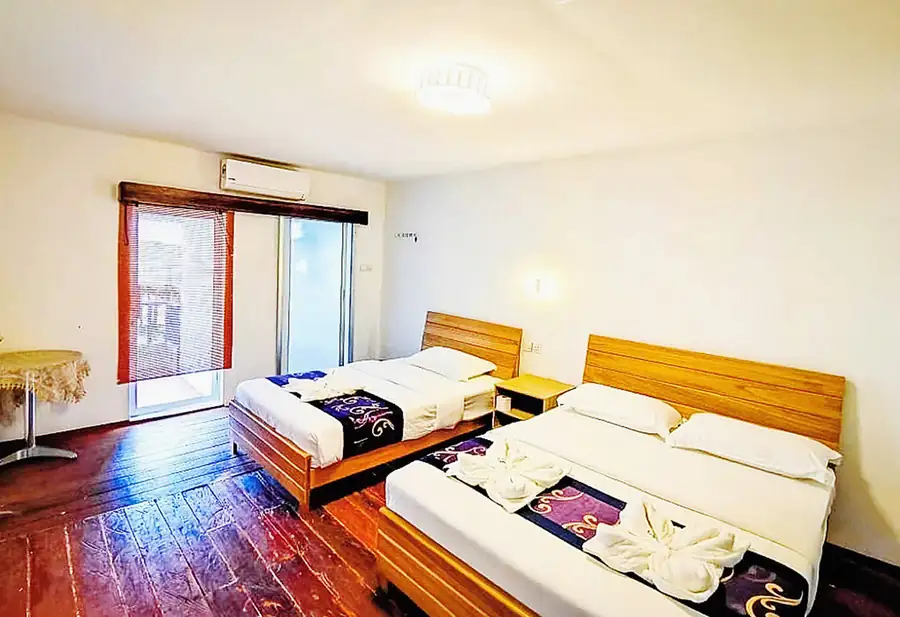 Inviting family bedroom at Amina Holidays Family Room on Mabul Island